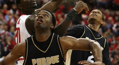 Purdue's Carl Landry (center) and David Teague